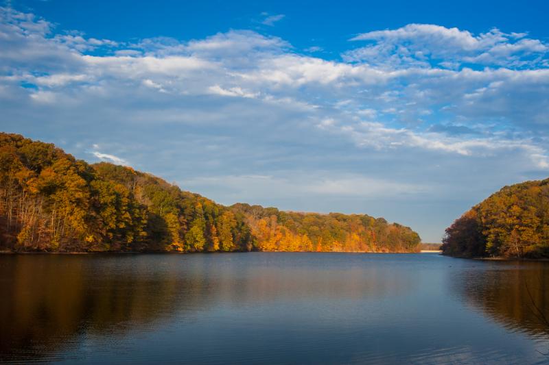 Griffy Lake surrounded by colorful autumn trees near Bloomington, Indiana